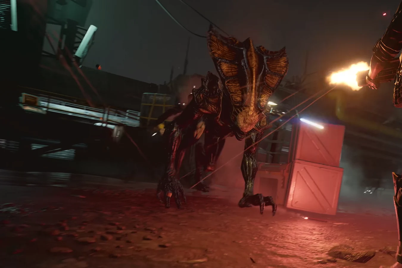 A Crusher Xenomorph charging through an industrial bay under rifle fire