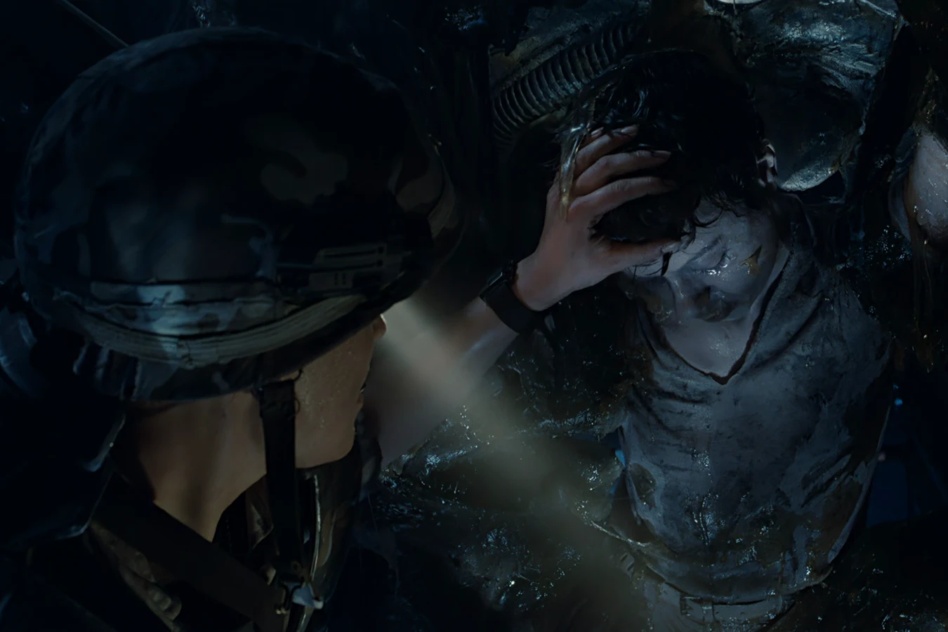 Dietrich's helmet lamp lighting a cocooned colonist in the Hadley's Hope hive in Aliens