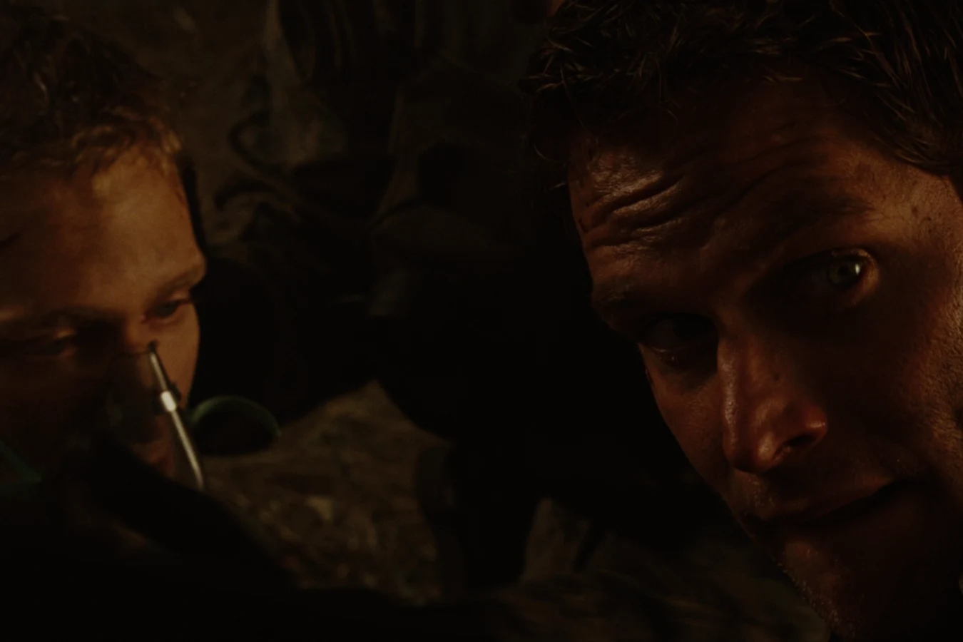 Dallas Howard beside his wounded brother Ricky after the helicopter crash