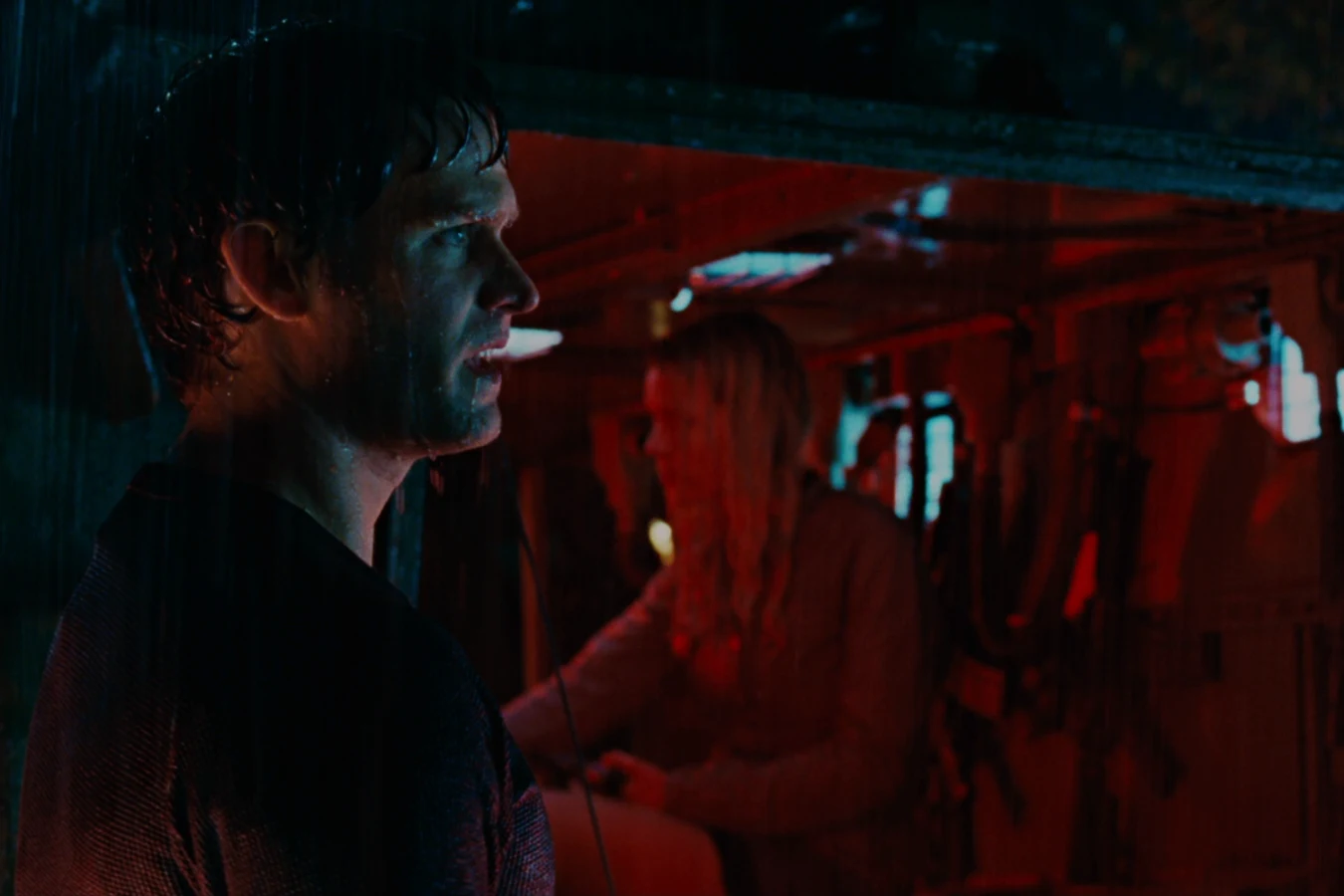 Dallas Howard and the survivors inside the National Guard Stryker under red light