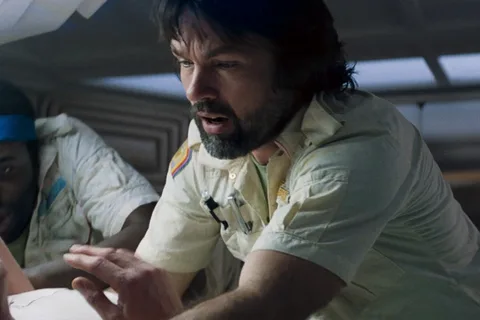 Captain Dallas leaning over Kane during the chestburst in Alien