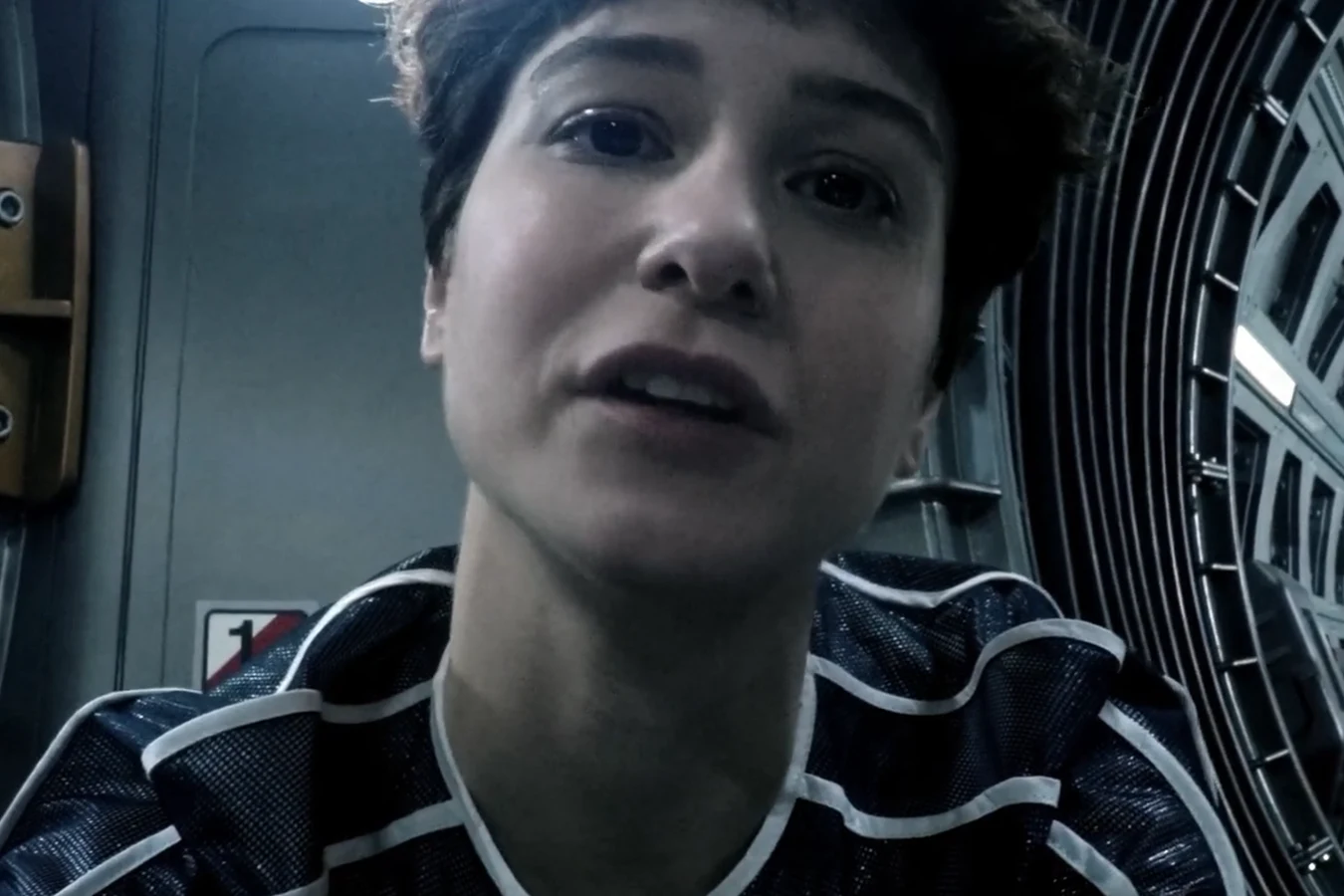 Daniels recording a video message to her father aboard the Covenant