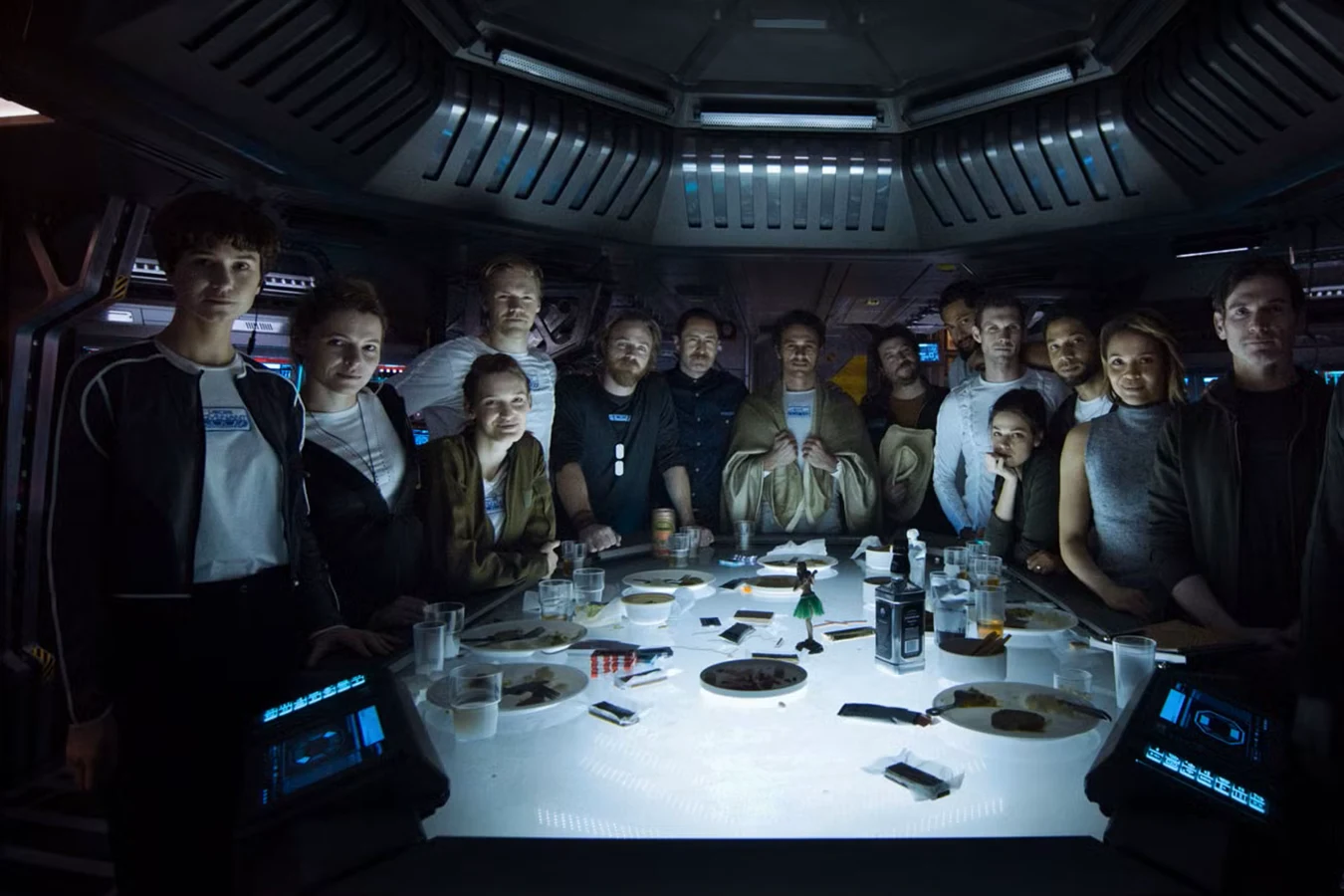 The Covenant crew gathered around the last meal table before hypersleep, with Daniels standing at the left