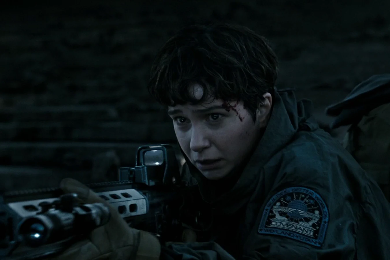 Daniels holding a customized rifle with a holographic sight after taking Ankor's weapon on Planet 4