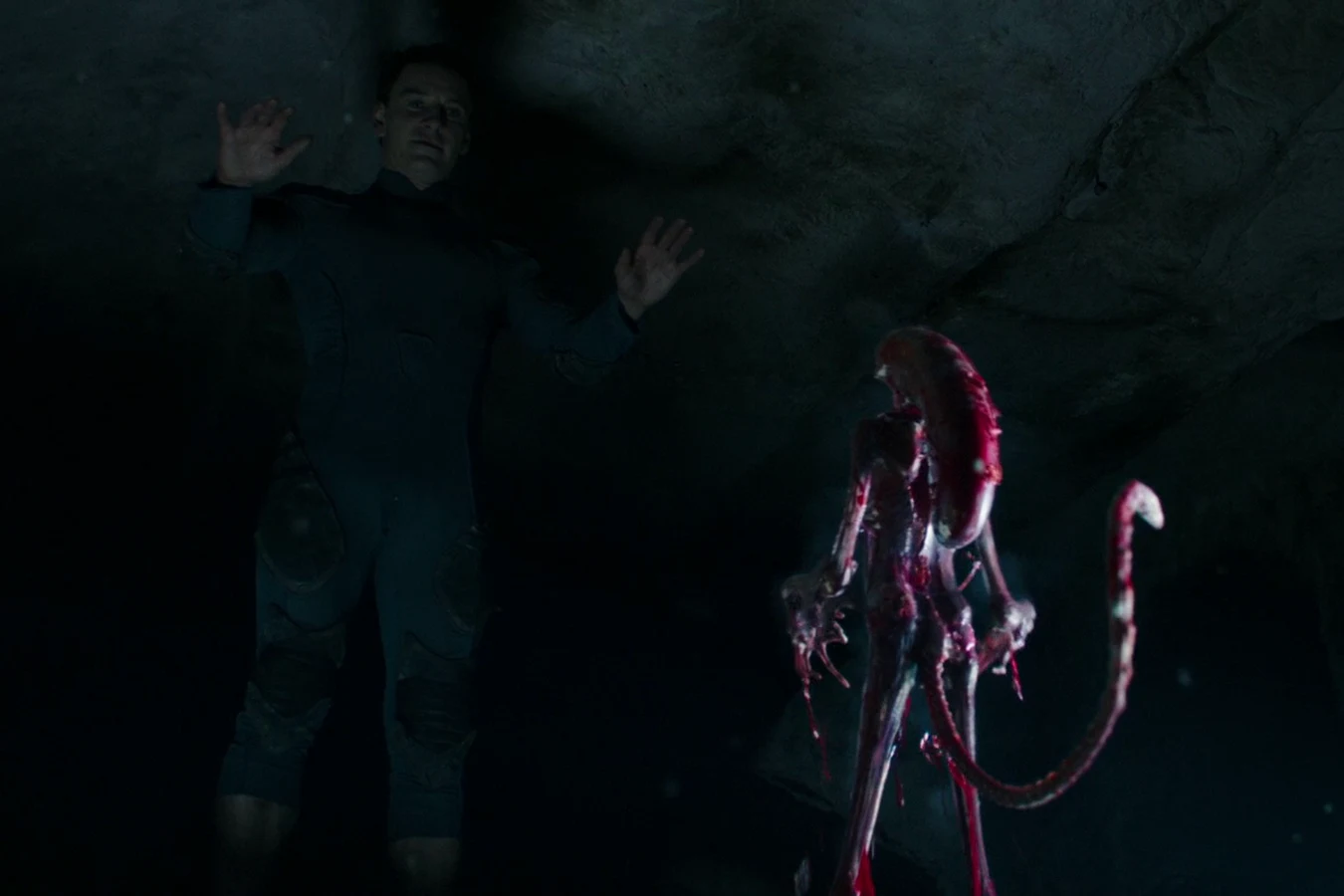 David raising his arms as the newborn Protomorph mirrors him in the chamber below the temple