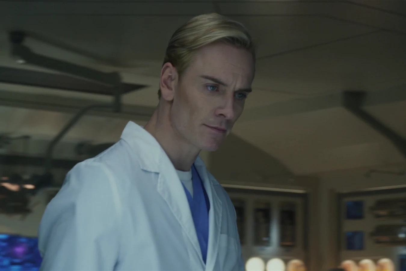 David in a white lab coat in the medical lab of the Prometheus