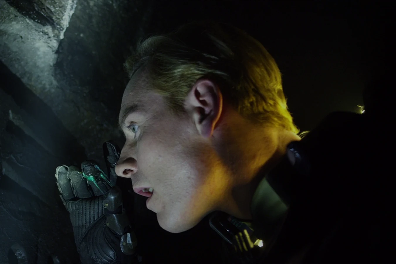 David leaning close to a carved wall inside the pyramid on LV-223