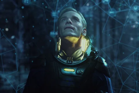 David in his Prometheus spacesuit standing inside the glowing Engineer star map