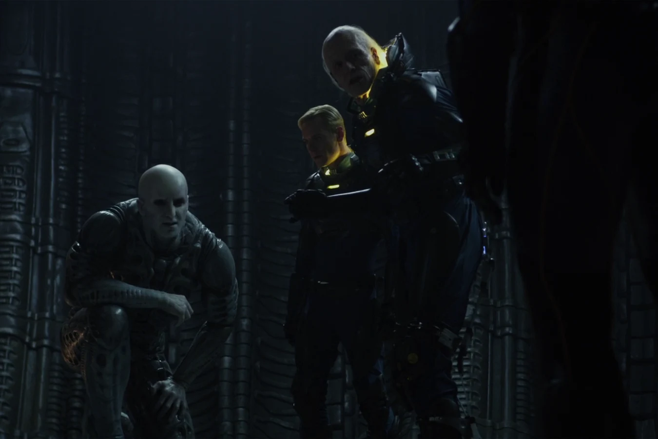 David beside Peter Weyland as the last Engineer stands in its stasis chamber