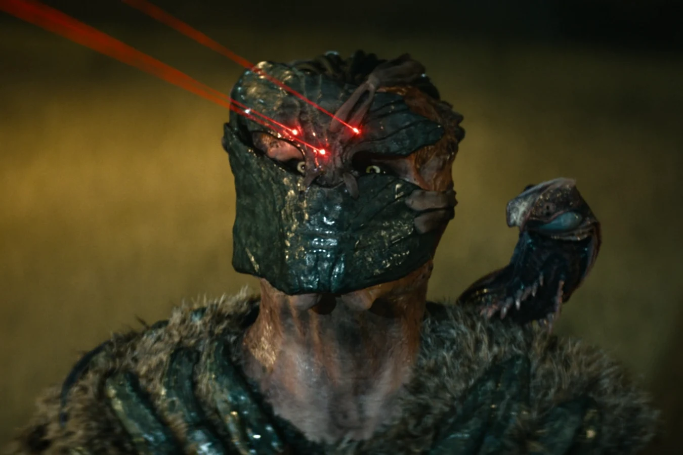Dek Predator in Bone Bison armor with Squirt on his shoulder in Predator: Badlands
