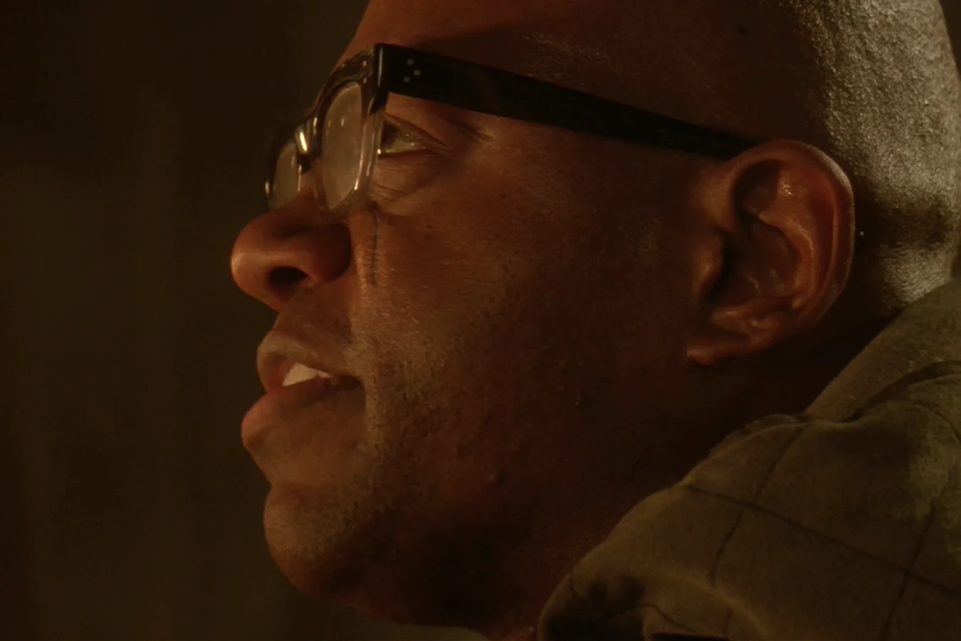 Dillon in profile with his glasses at the cremation in Alien 3