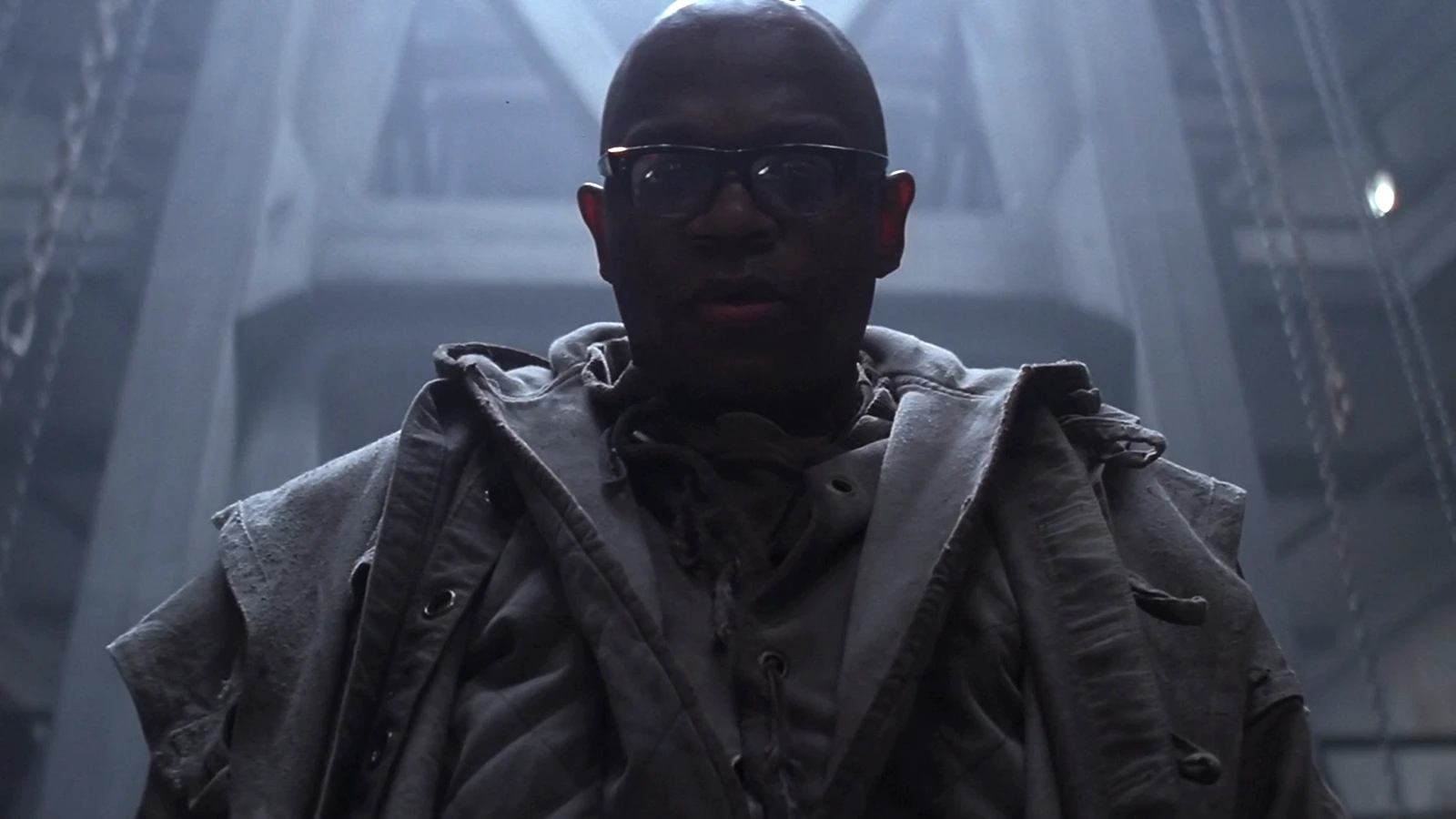Dillon in glasses and a heavy coat in the Fiorina lead works in Alien 3