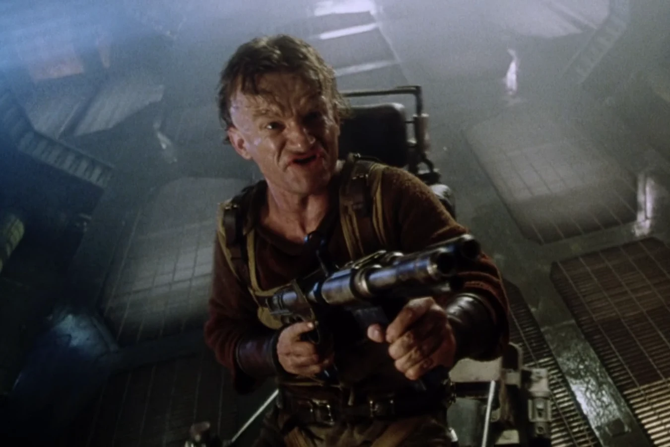 Vriess firing a shotgun from his wheelchair in the Auriga stores