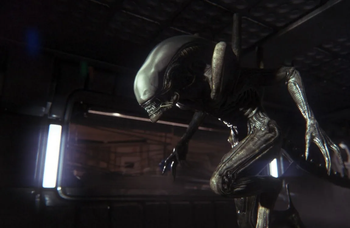 A Drone Xenomorph emerging from the darkness