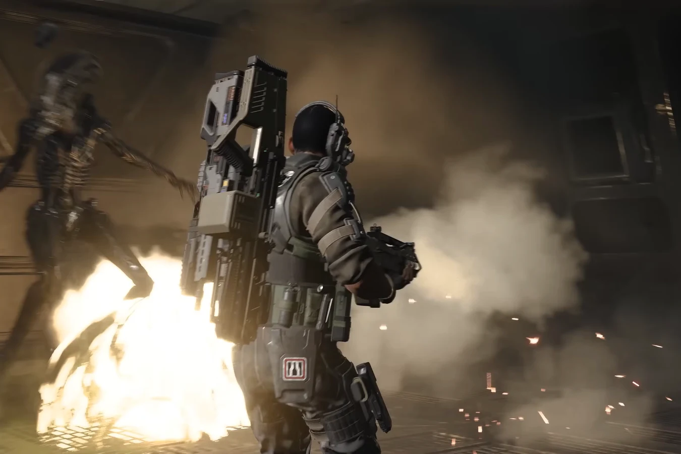 Duelist Marine standing in a Xenomorph hive as an explosion flares beside him