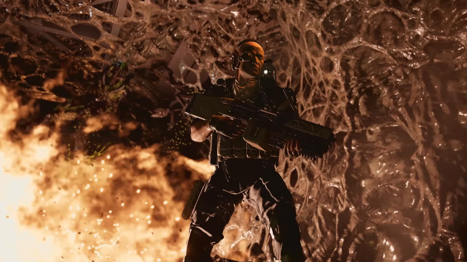 Duelist class Marine with a heavy weapon in a Xenomorph hive in Aliens Fireteam Elite 2