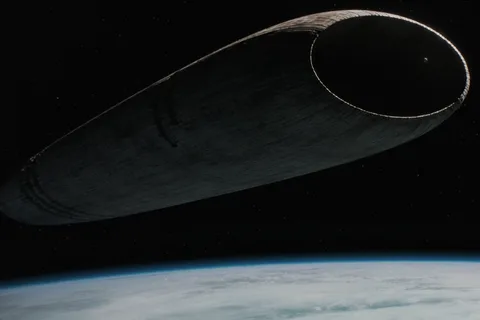 A Guild Heighliner floating above a planet in deep space