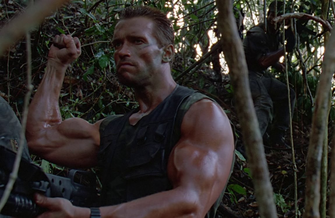Dutch Schaefer making a hand signal in Predator