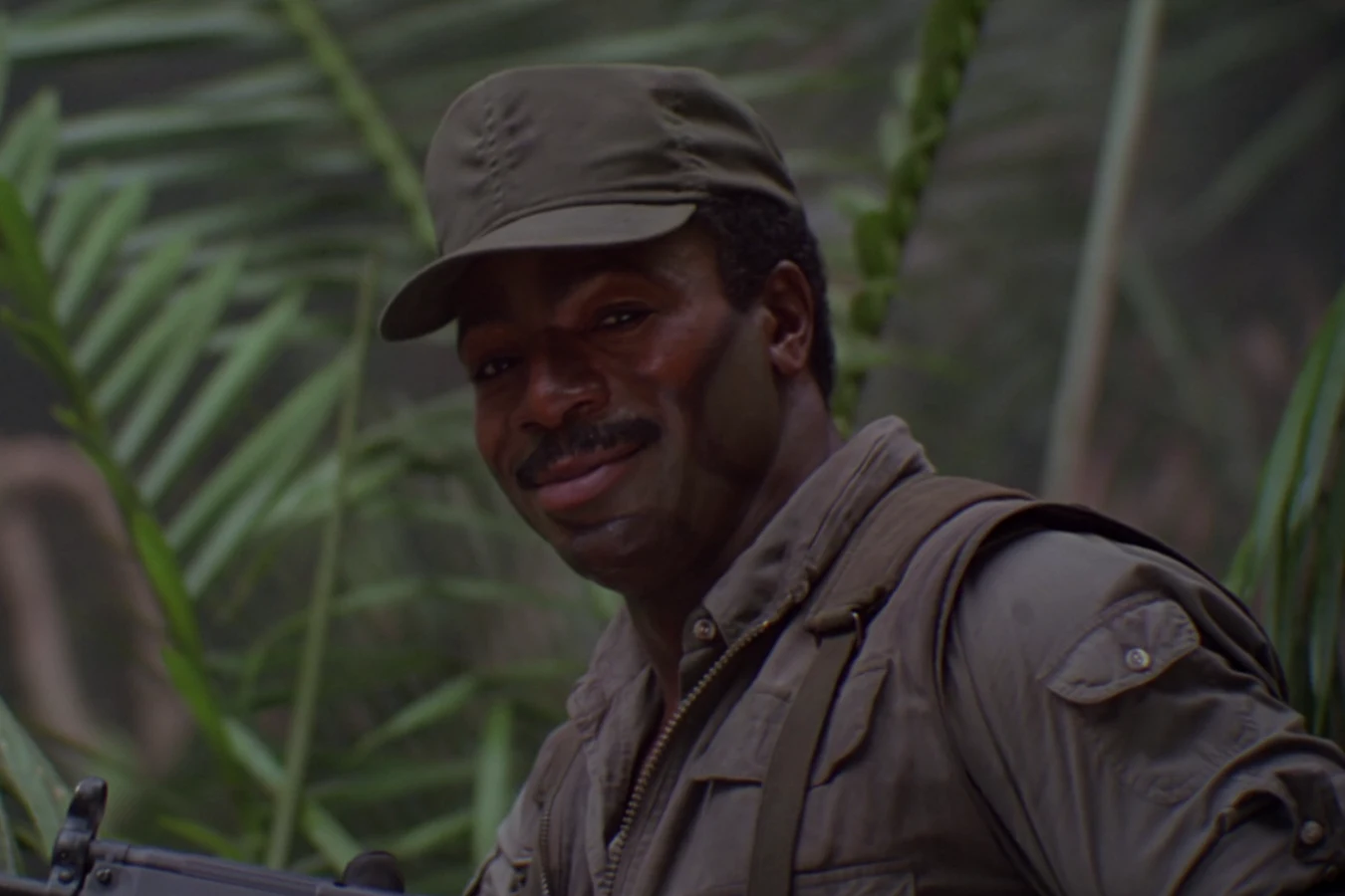 George Dillon with his submachine gun in the jungle in Predator