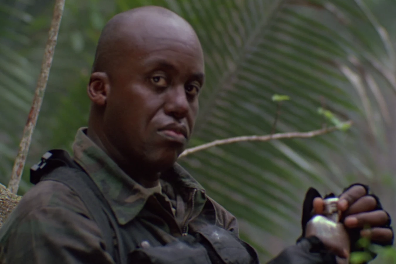 Mac Eliot holding a flask after Blain's death in Predator
