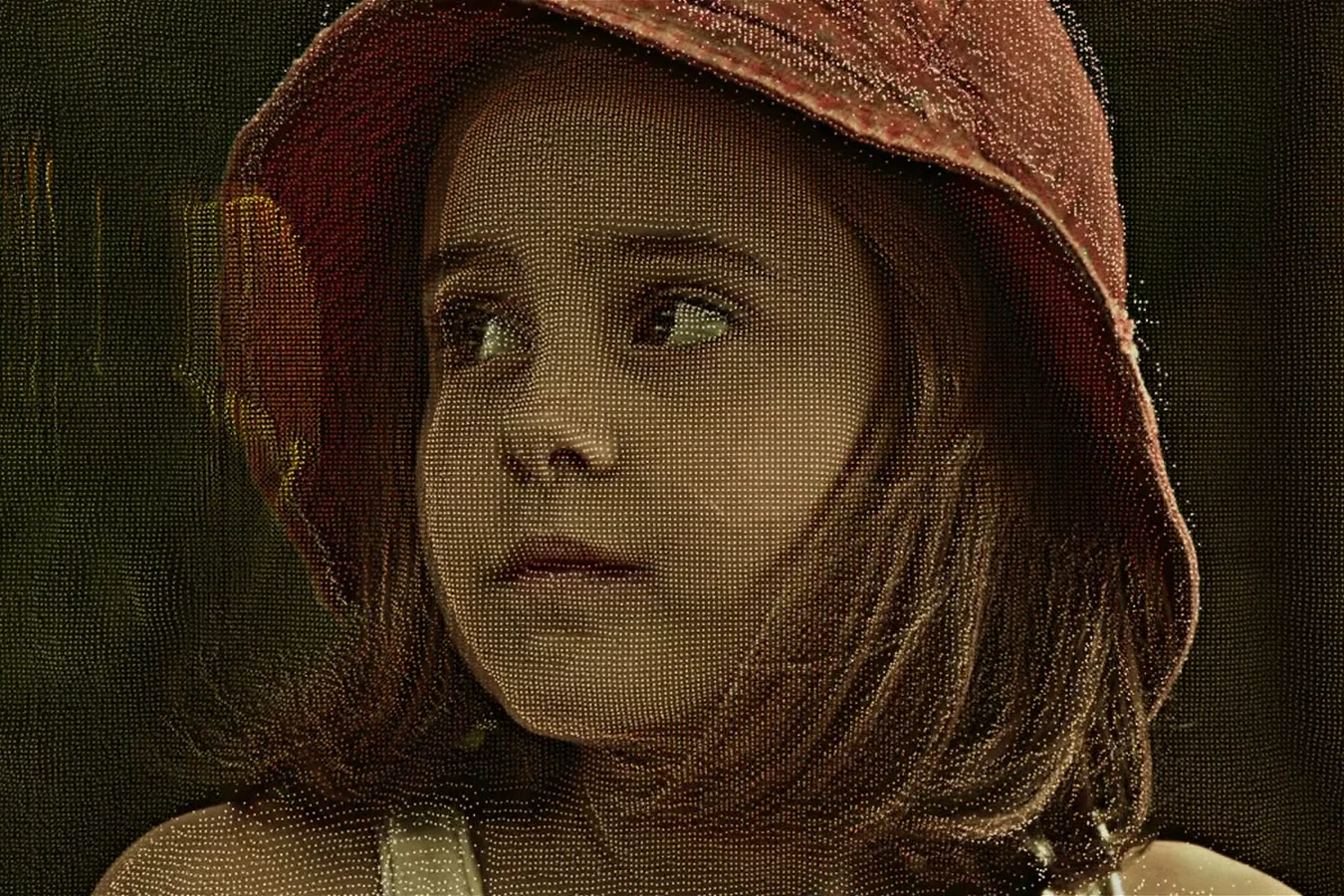 Young Elizabeth Shaw in a red hat, the childhood memory David watches while she is in hypersleep