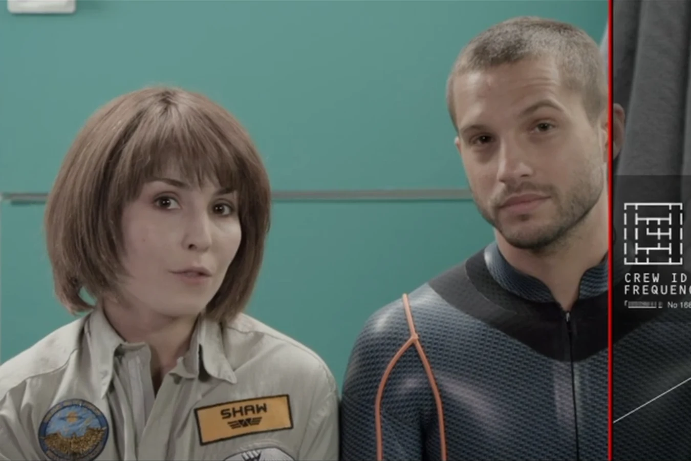 Elizabeth Shaw and Charlie Holloway recording the Prometheus greeting, her name tag visible