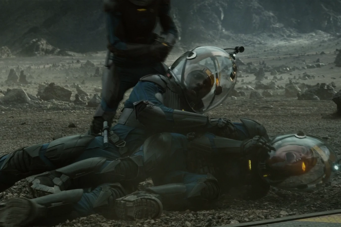 Elizabeth Shaw in a spacesuit as Charlie Holloway burns in the flamethrower blast at the Prometheus ramp