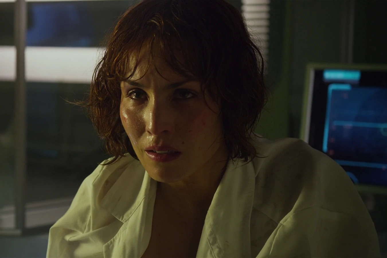 Close view of Elizabeth Shaw in a soiled white shirt, sweating, after the MedPod surgery