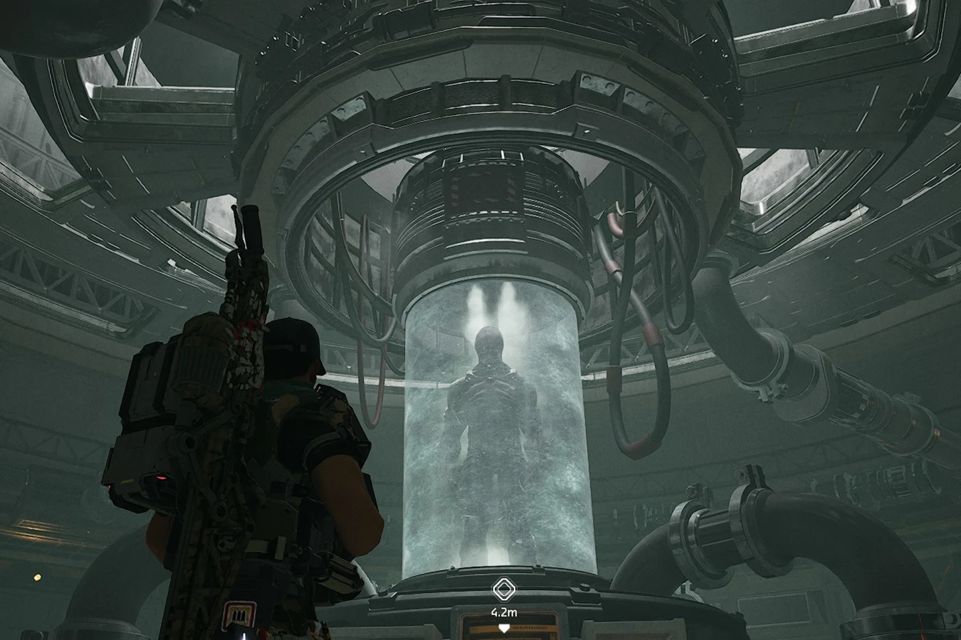 A dead Engineer standing in a vapor-filled tank at Storr's Boon in Aliens: Fireteam Elite 2