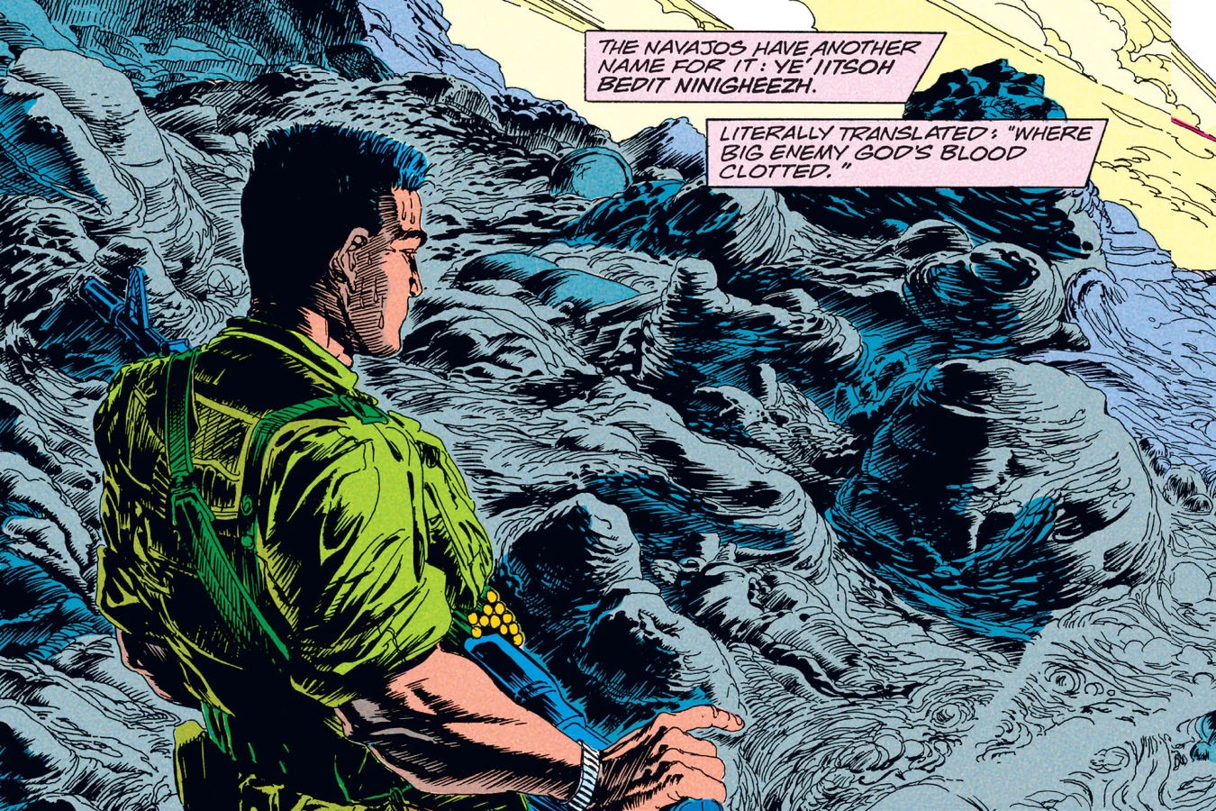 Enoch Nakai stands on the black lava of El Malpais at sunrise with his M60 machine gun in Predator: Big Game