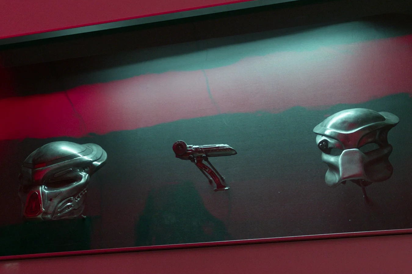 Two bio-masks and a shoulder cannon in a lit case at the Stargazer dam