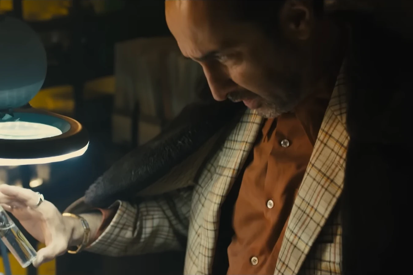 Salt in a checked jacket examining a vial of Sapper's protein under a lamp in 2048: Nowhere to Run