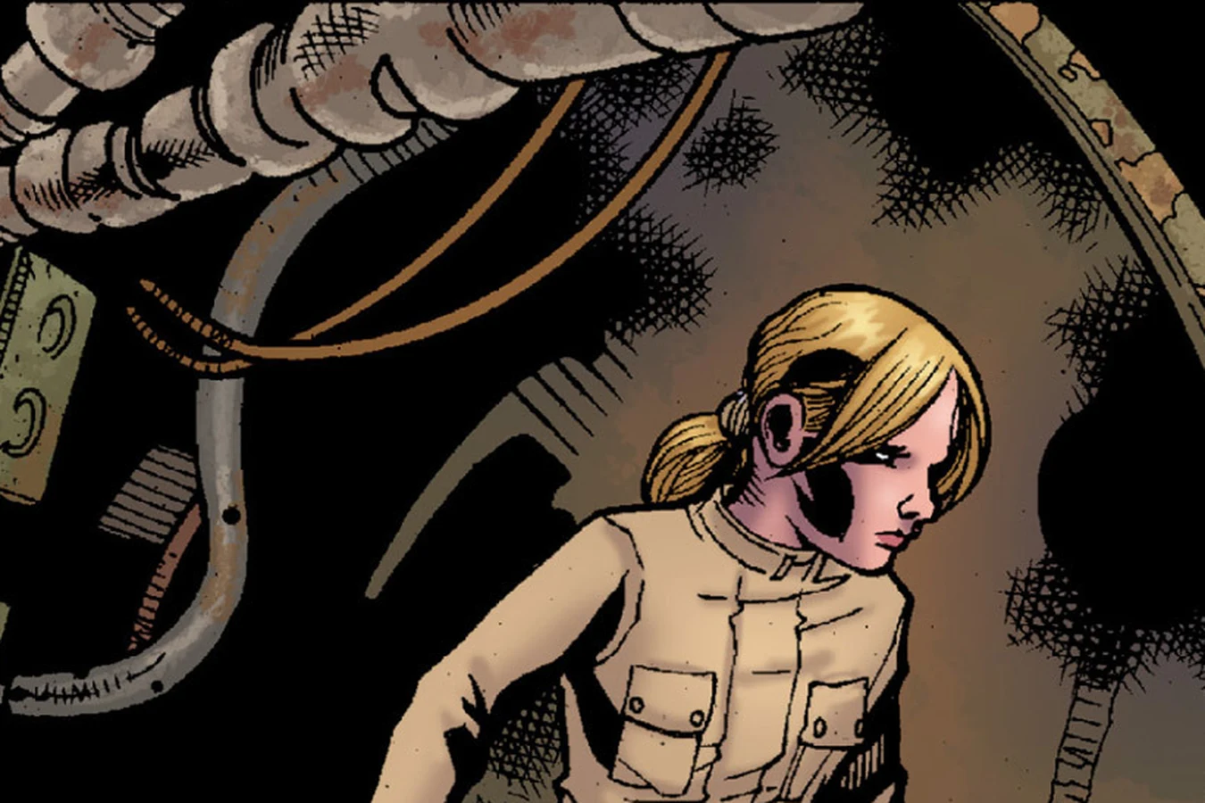 Buffy in a tan jacket creeping through a dark machinery corridor lined with pipes