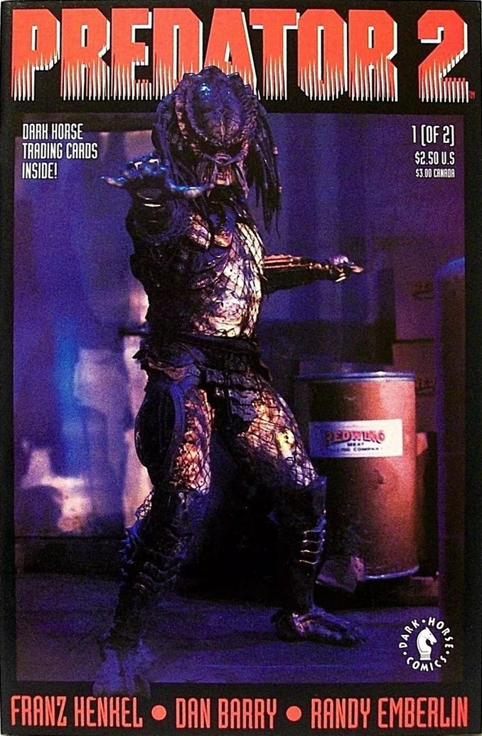 Photo cover of Dark Horse's Predator 2 #1, with the Predator reaching out a clawed hand in a dim, blue-lit warehouse