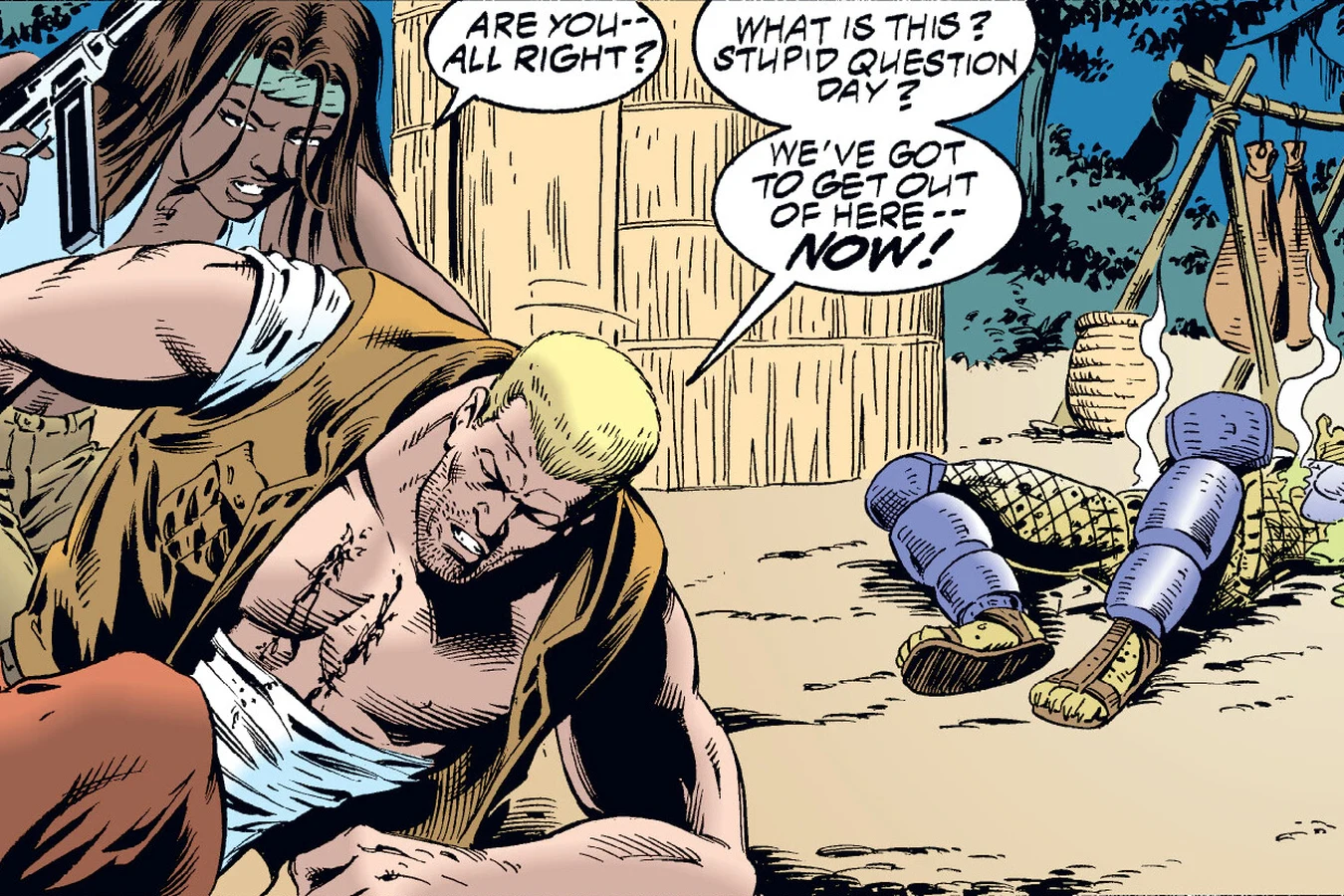 Lopez holding the wounded Schaefer as the fallen Predator stirs behind them in the Predator: Dark River comic