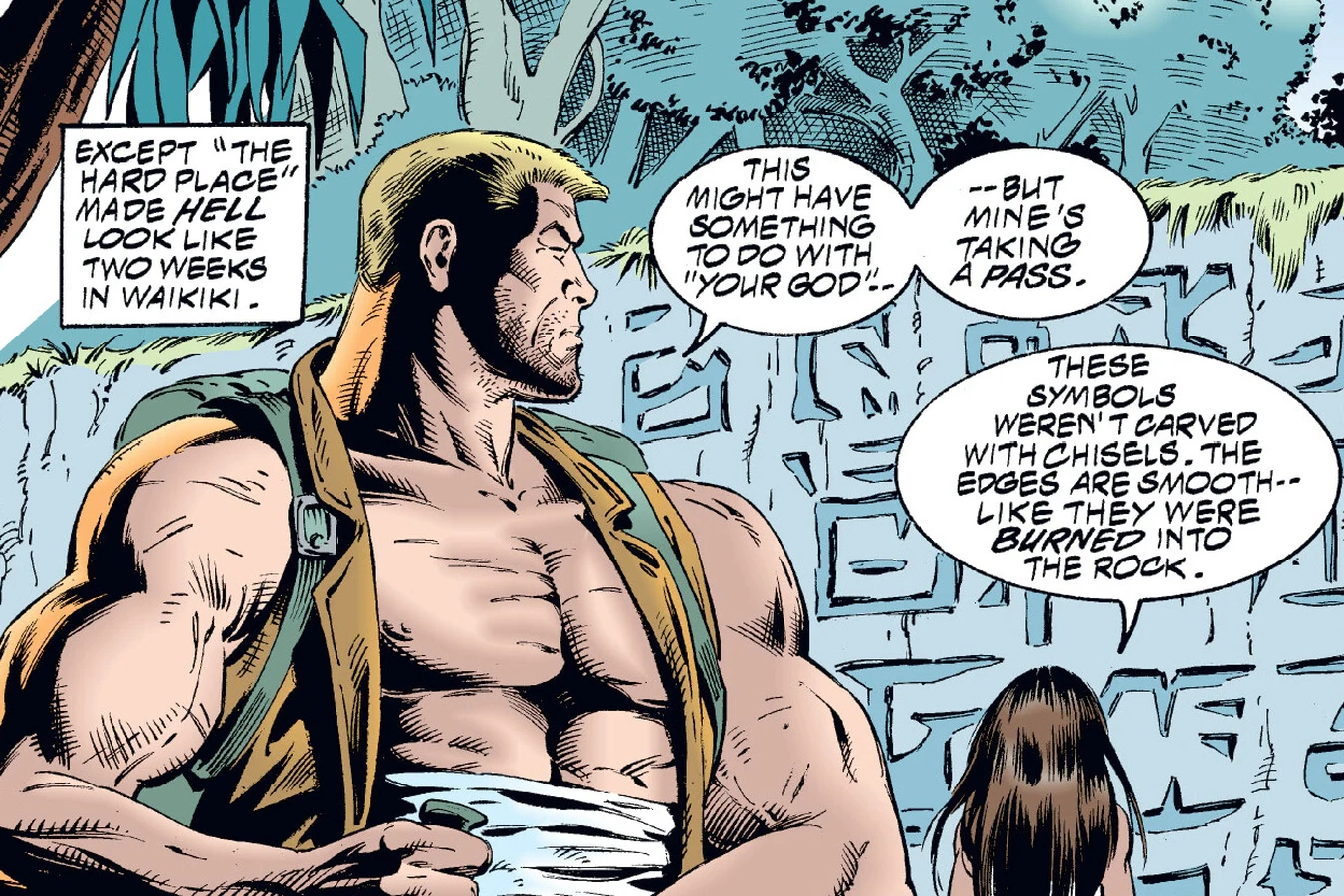 Schaefer and Lopez examining the wall of symbols burned into the jungle rock in the Predator: Dark River comic