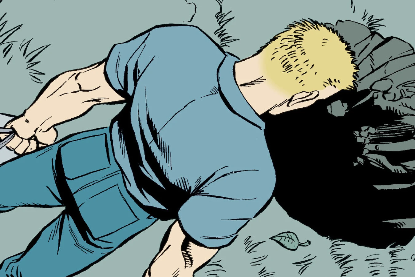 Seen from above, Buddy Wilcox in a blue shirt and jeans carries a bag past a freshly dug hole in the grass of the forest