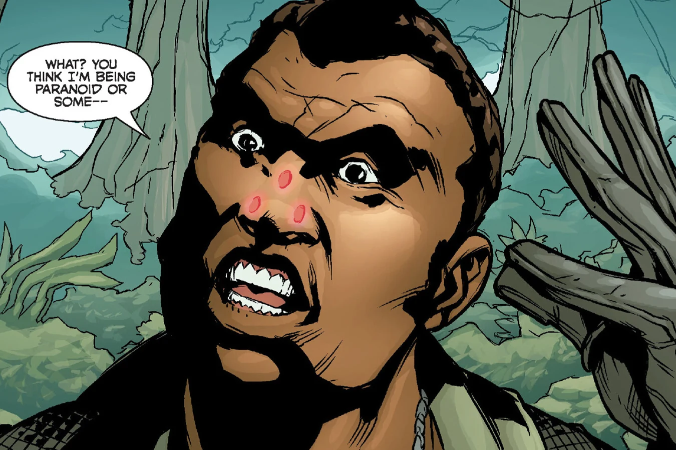 A soldier freezes as three Predator laser targeting dots lock onto his face in Predator: Welcome to the Jungle