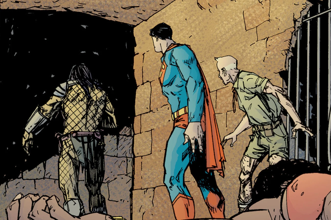 Superman and Casey Trabor releasing the Predator from a cell in Superman vs. Predator