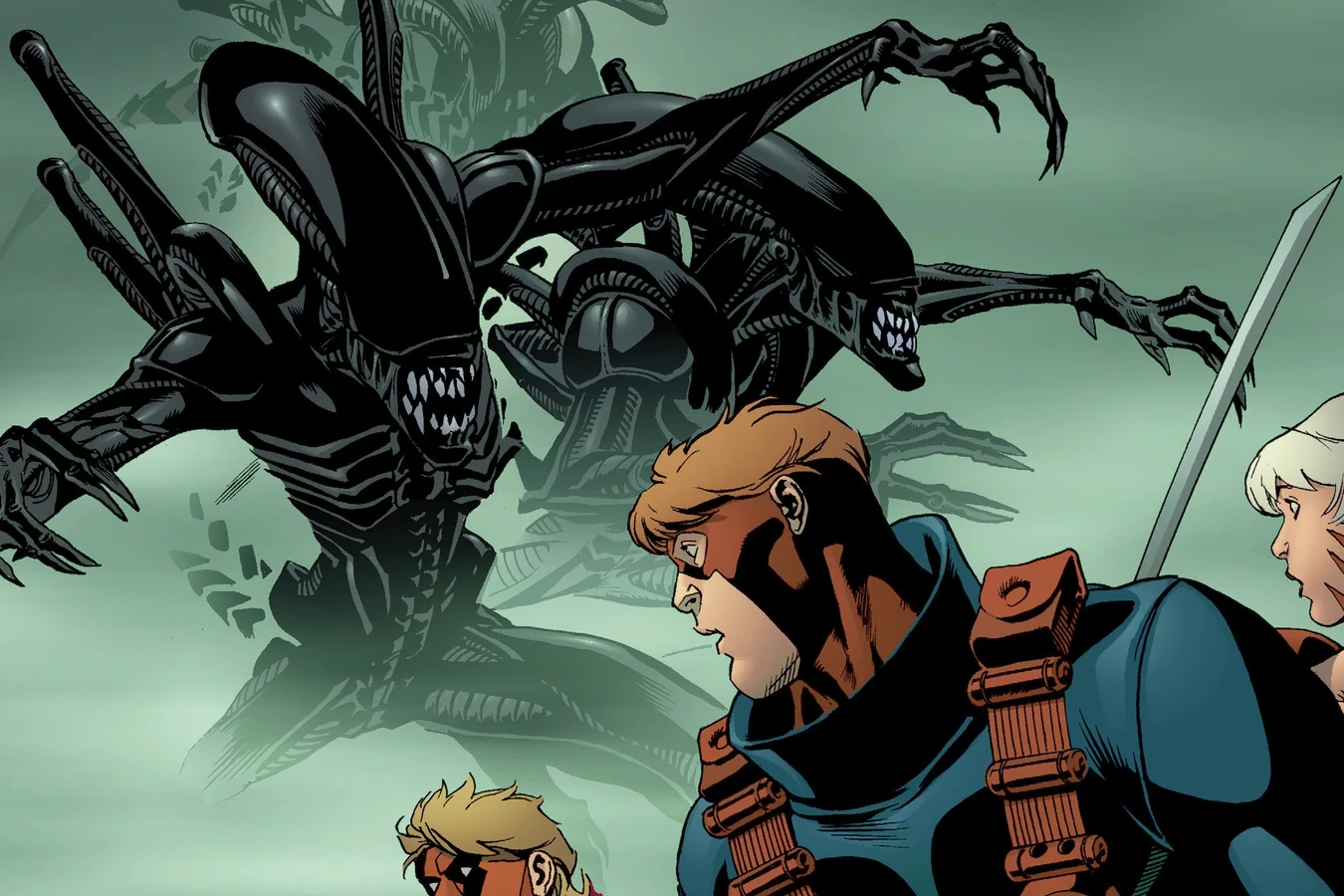 Xenomorphs lunging out of the mist in the Cold Penitentiary as Grifter turns to face them