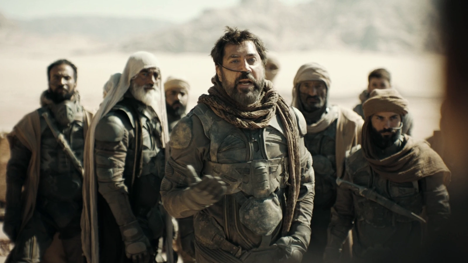 Fremen warriors in stillsuits standing in the desert of Arrakis