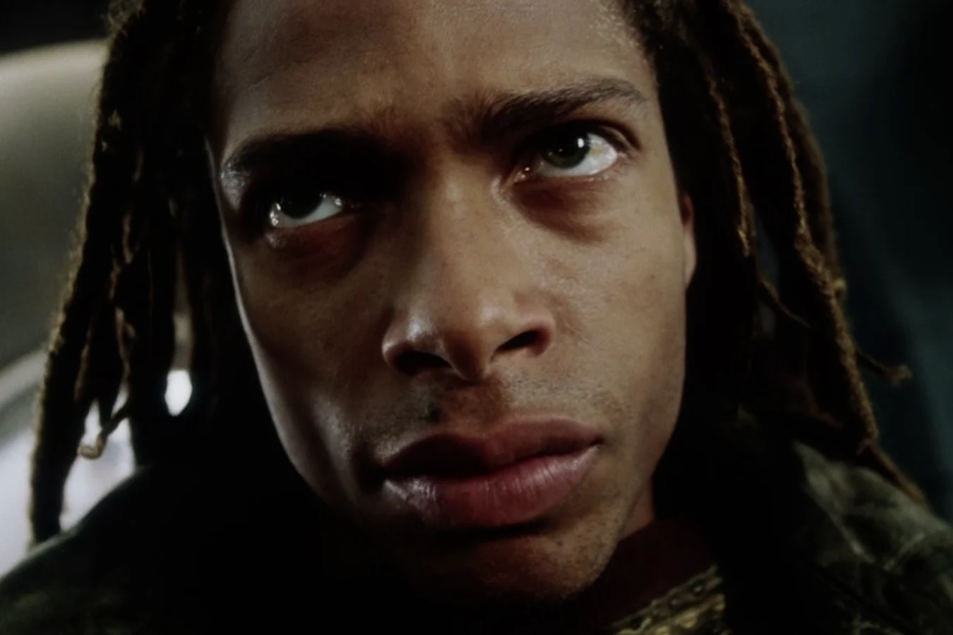 Close-up of Christie looking up as he takes charge of the survivors