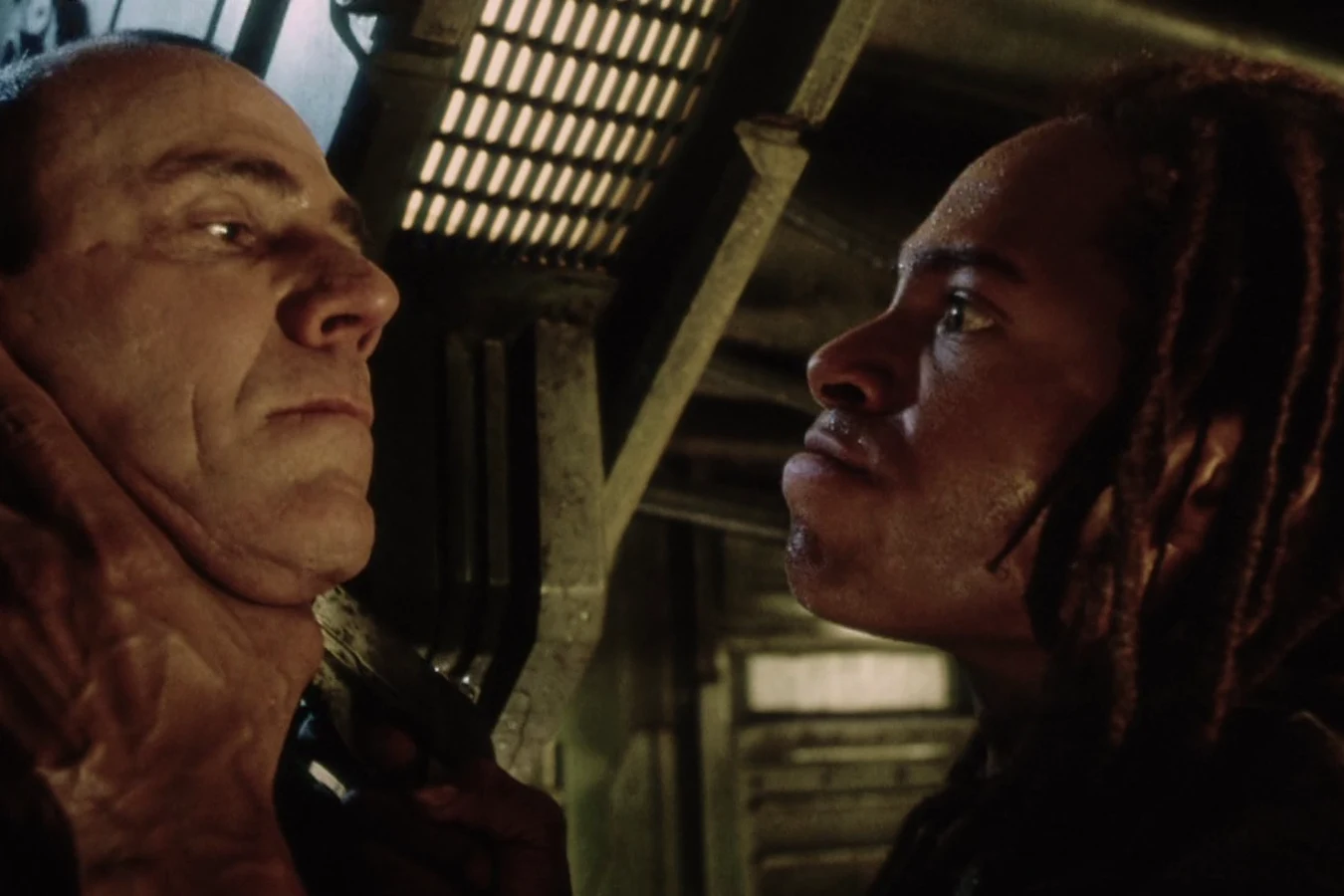 Christie holding Dr. Wren at gunpoint after the mess hall shootout