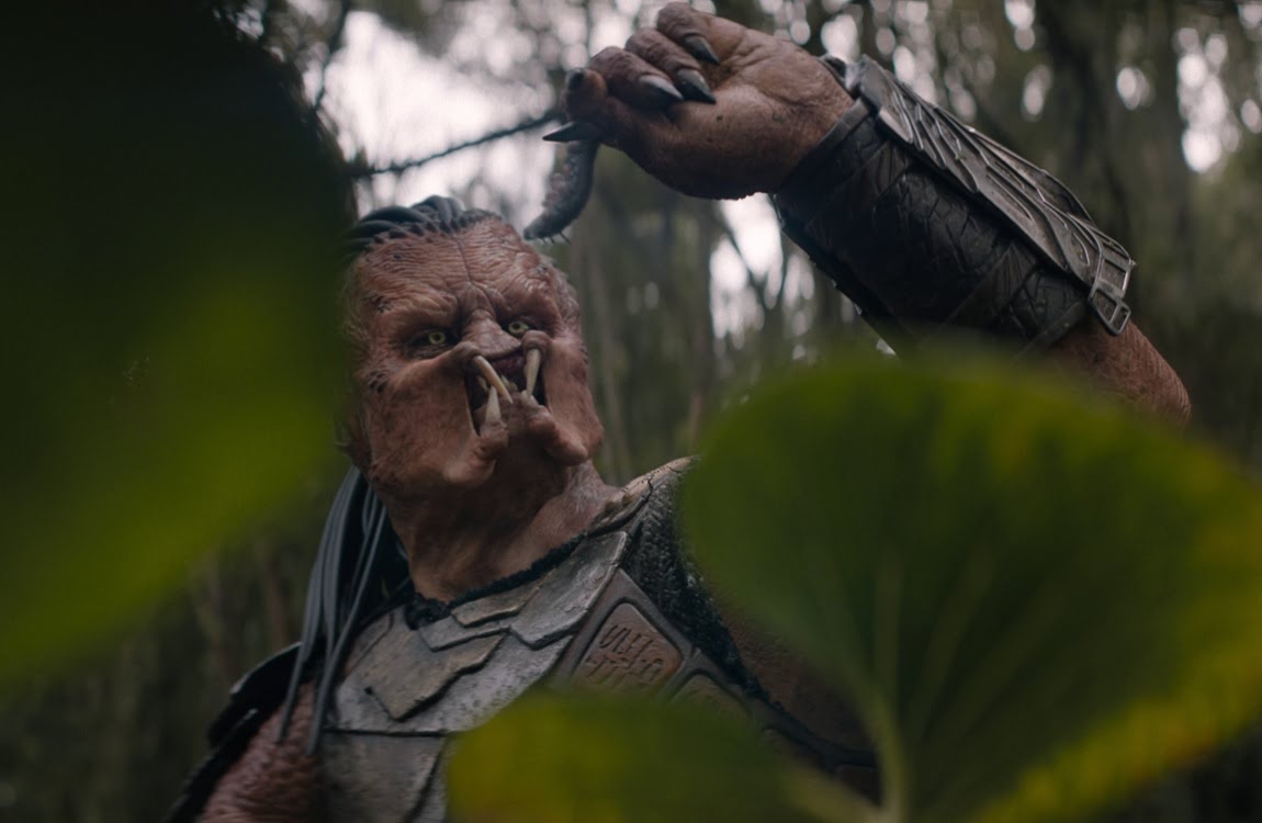 Dek holding an explosive worm on Genna