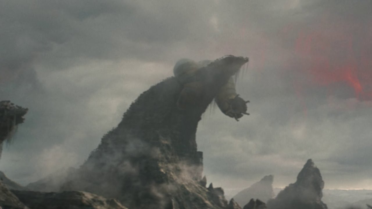 A giant worm biting a mountain in Predator: Badlands