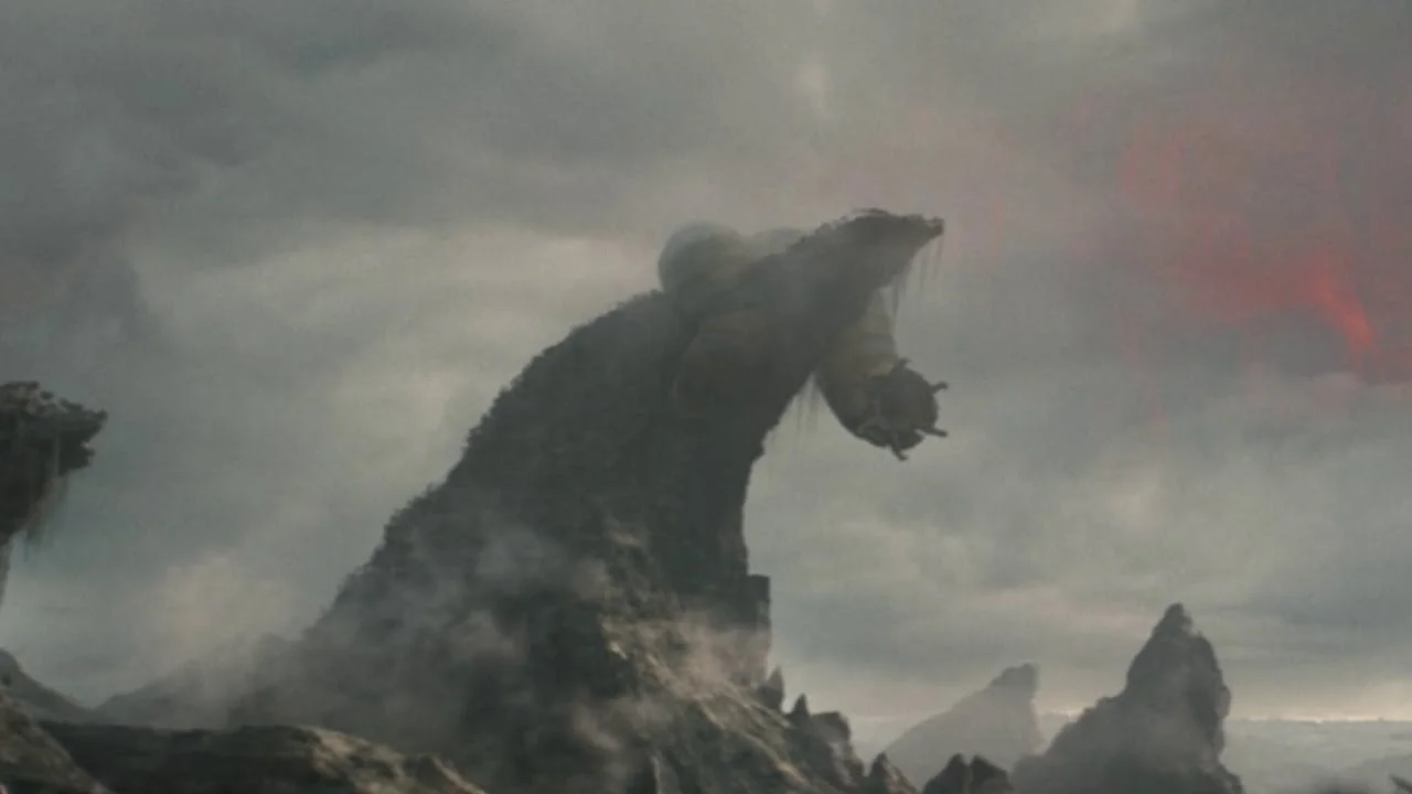 A giant worm biting a mountain in Predator: Badlands