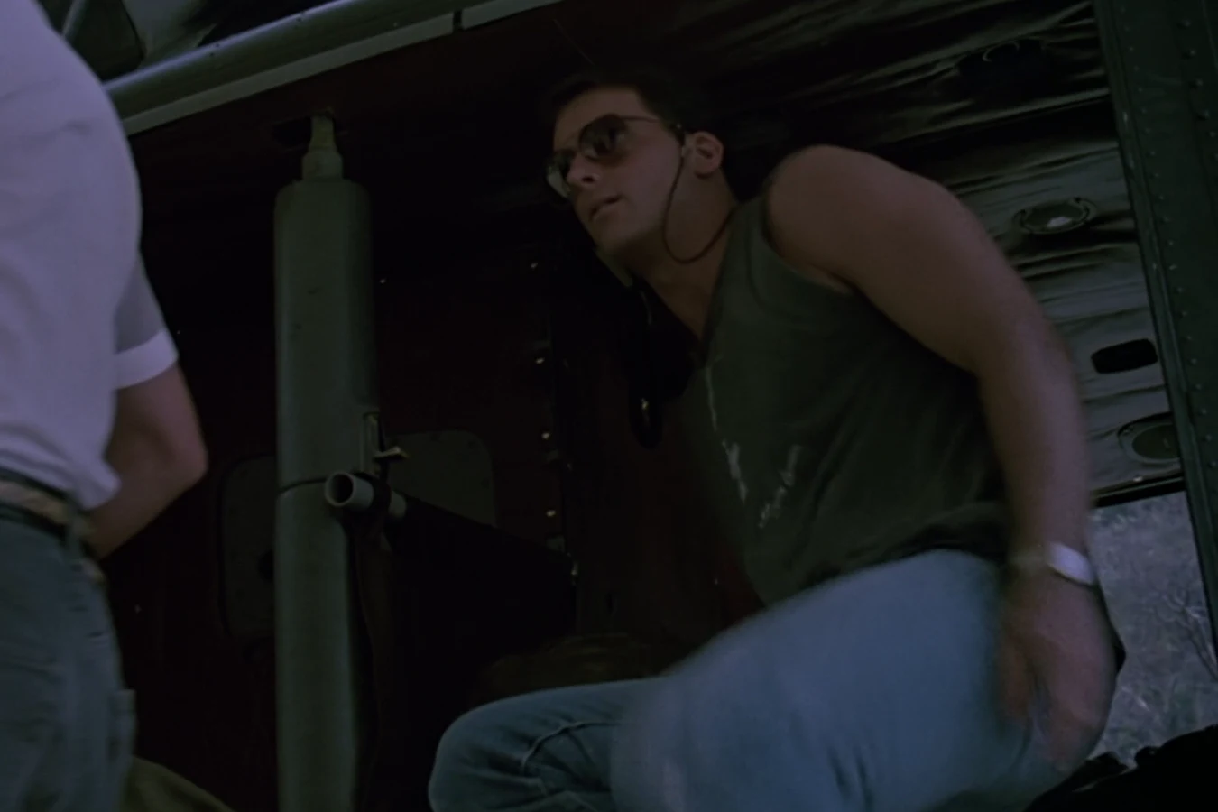 Rick Hawkins in a tank top and jeans before the mission in Predator