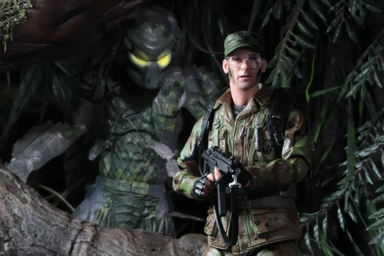 The NECA Rick Hawkins action figure from the Predator 30th Anniversary line posed beside a Jungle Hunter figure