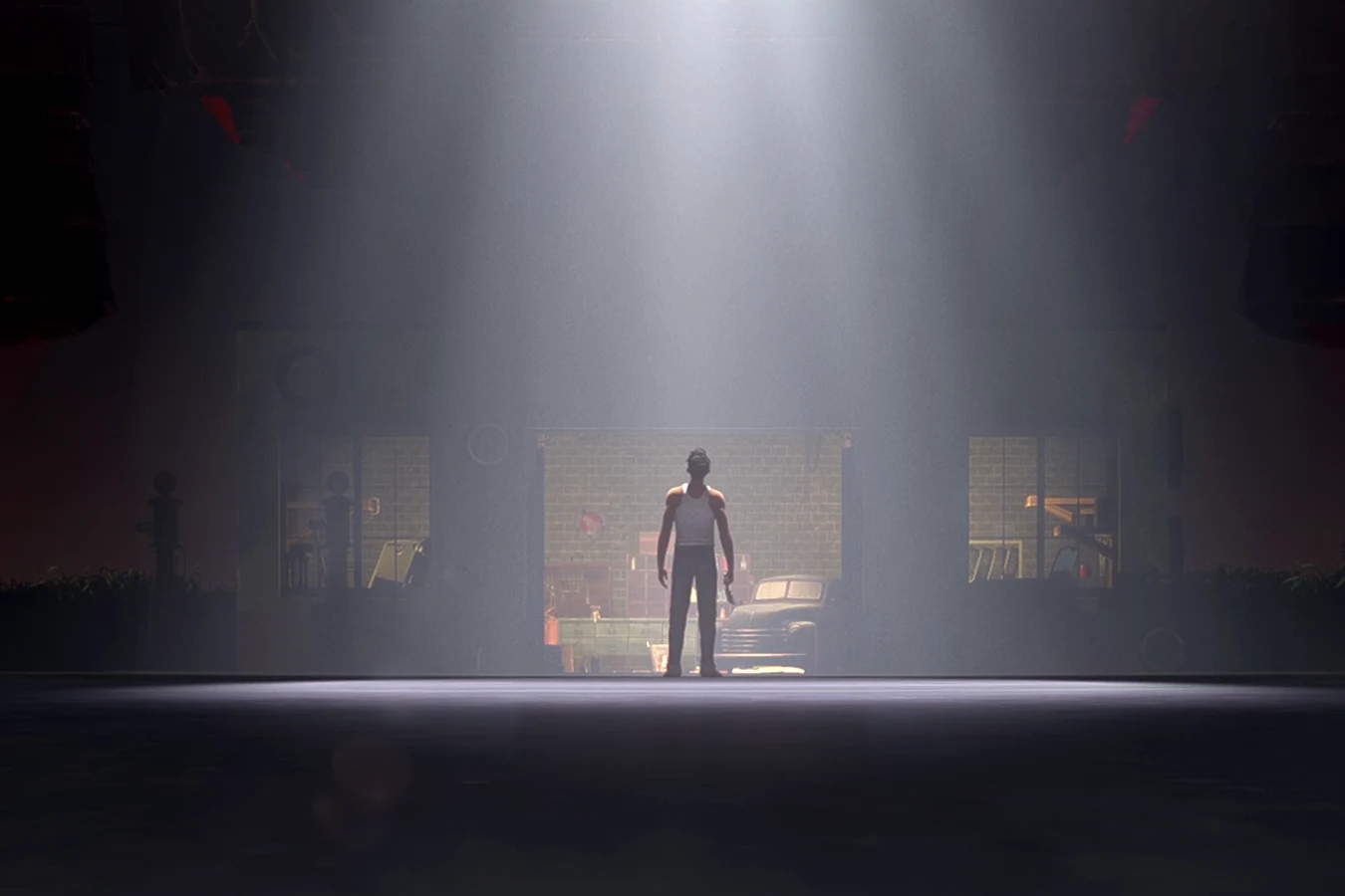 Torres stands in his garage doorway as a Predator ship lights the field