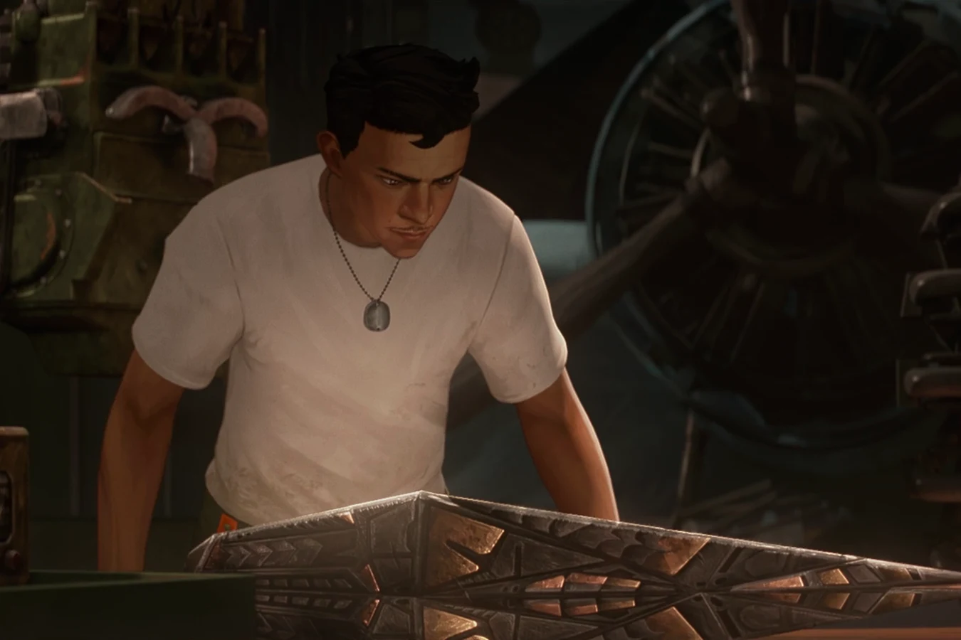 Torres studies a piece of Predator wreckage on a workbench aboard the Ranger
